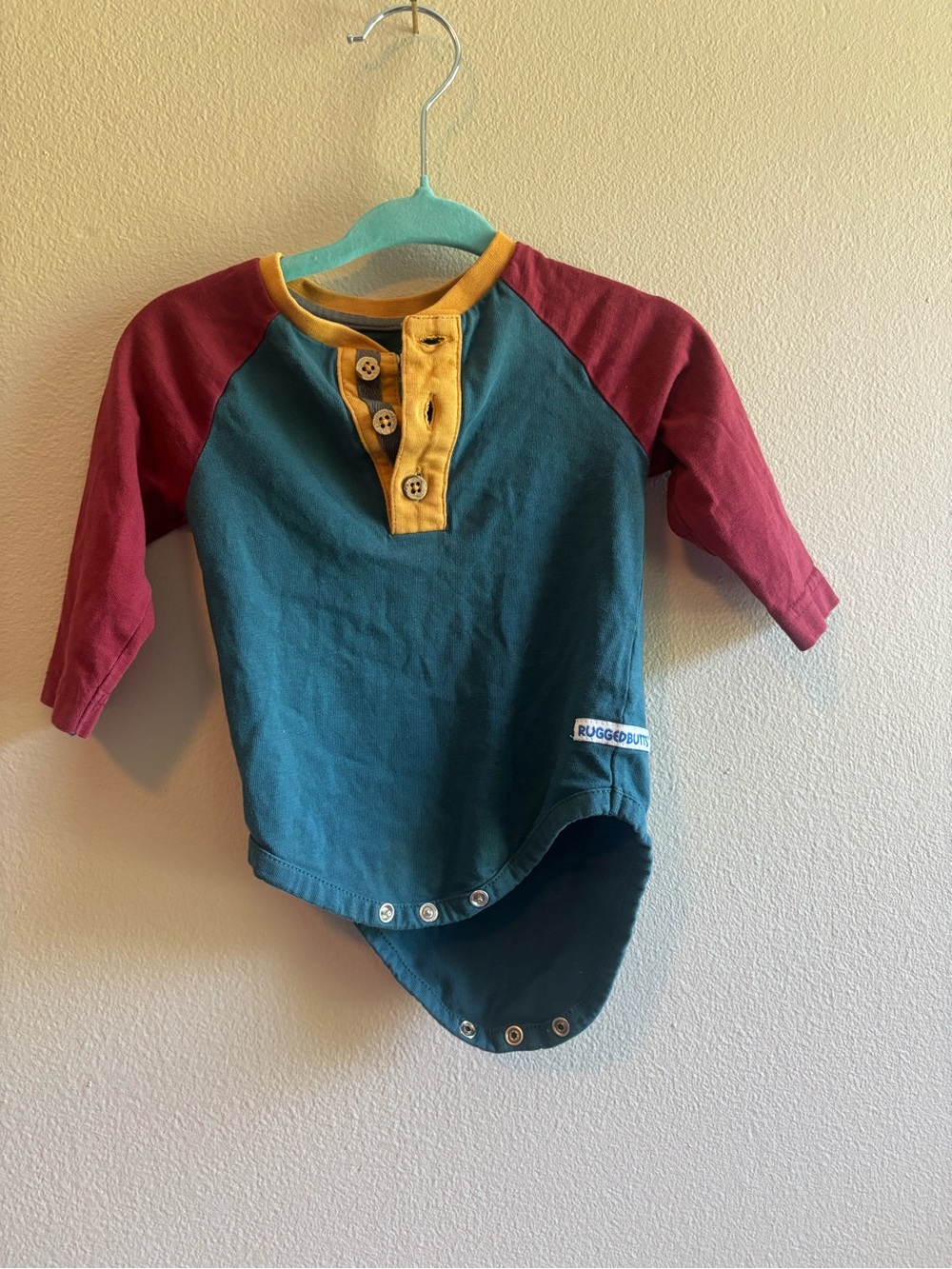 RuggedButts Colorblock Henley One-Piece Bodysuit - Teal, Maroon & Mustard